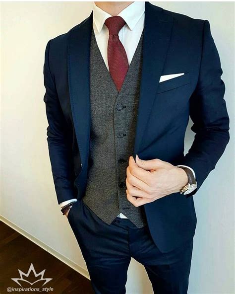 blue suit with gray vest.